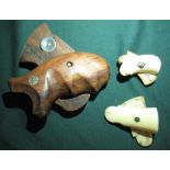 Two pairs of 19th C ivory pistol grips 5.5cm and 5cm, and a pair of wooden Smith & Wesson pistol