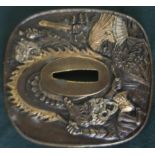 Japanese bronze Tsuba decorated with various mythical figures, with signature panel to the