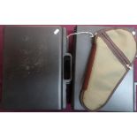 Four plastic hard carry cases with foamed lined interiors suitable for pistols, and a padded