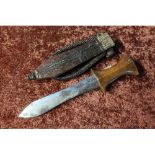North African arm dagger with 5 1/2 inch swollen blade, wooden grip and leather sheath with