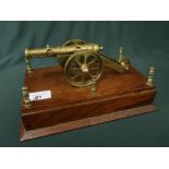 Well detailed miniature brass cannon model mounted on wooden plinth