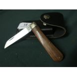 Sheffield made single bladed pocket knife with polished wood grip and leather belt pouch