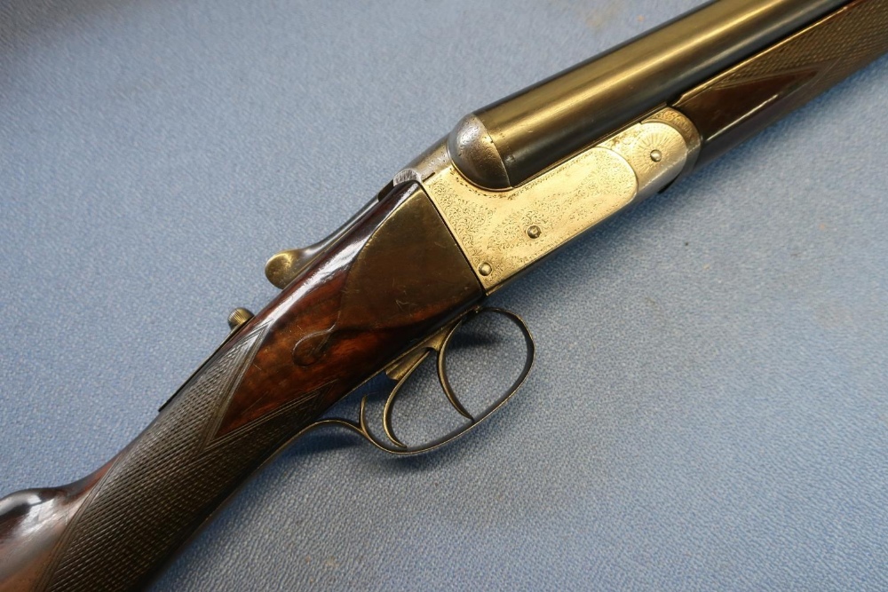 Unnamed 12 bore side by side shotgun with 28 inch barrels and 15 1/4 inch straight through stock,