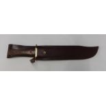 Bowie type knife with 9 inch blade with brass cross piece and two piece wooden grip, made in