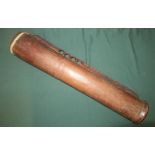 19th/20th C tribal carved wood drum style instrument with leather skin top, length 58cm