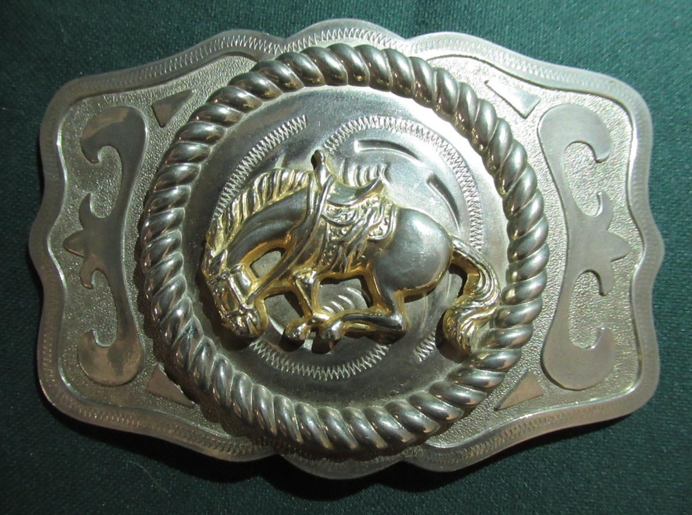 Metal belt buckle with a bucking bronco and a belt buckle with the badge of the Kenyan Prisons - Image 2 of 3