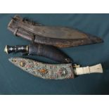 Bone handled kukri with ornate decoration to scabbard, small belt sized kukri, kukri blade and a