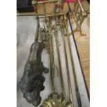 Set of three brass fire irons with turned finials L68cm, a pair of early 19th C brass fire implement