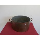 Large country house kitchen beaten copper cooking pot with twin cast brass handles retained by