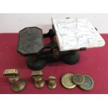 Set of vintage scales with various brass weights