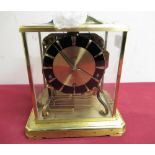 Mid 20th C Schatz mantel clock lacquered brass case with four glazed panels on platform base,