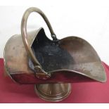 Early 20th C copper coal helmet with swing handle on stepped tapering base stepped, stamped with