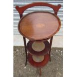 Edwardian inlaid mahogany cake stand, three circular graduated tiers on square supports H80cm, a