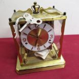 Mid 20th C Schatz mantel clock, lacquered brass case with four glazed panels on platform base, three
