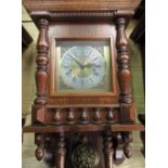 Late 20th C German wall clock, oak case with carved columns and gallery, single glazed panelled door