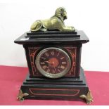 19th C Egyptian Revival slate and rouge marble mantel clock, case surmounted with recumbent brass