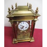 Early 20th C French four glass mantel clock, gilt brass architectural case enclosing four bevel