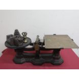 Early 20th C cast iron and brass grocery scales, brass carrying handle and tray