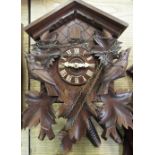 Late 20th C Hubert Herr Black Forest cuckoo clock, caved and stained case with two train weight