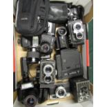 Various cameras including Kodak 620 Brownie, Yashica Minister, Olympus OM101, two Yashica 635's,