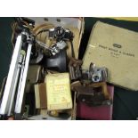 Photographic equipment including an Olympus OM10 and 50mm f1.8 lens, tripod, Paterson film tanks,