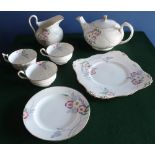 New Chelsea tea service printed and enameled with flowers, eight cups, two jugs, tea pot, sandwich