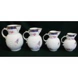 Set of four Coalport reproduction "Caughley Mask-Head" graduated jugs (4)