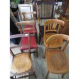 Victorian elm and beech farmhouse elbow chair with spindle back and turned front legs, a pair of