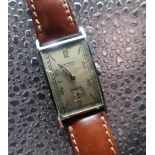 Art Deco period Girard Perregaux mechanical wristwatch. Rectangular chrome plated case on leather