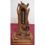 Early 20th C Black Forest desk thermometer, carved with a Tyrolean shepherd and his flock, H24cm