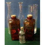 Three leaded glass panels , pair of slender decanters lacking stoppers and other glassware