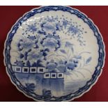 Japanese waved edge circular blue and white charger, all over decorated with chrysanthemums on a