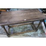 Oak rectangular dining table, moulded top on turned supports with stretcher W124cm D59cm H75cm and a