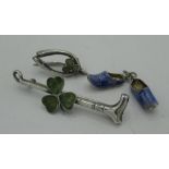 Pair of silver and blue enamel Dutch clog charms stamped 835, silver riding crop bar brooch set with