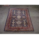20th C traditional Middle Eastern patterned rug, blue ground with scroll centre medallion and rust