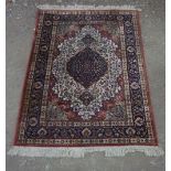 Silk style rug with central medallion and blue ground floral patterned border, 100cm x 150cm