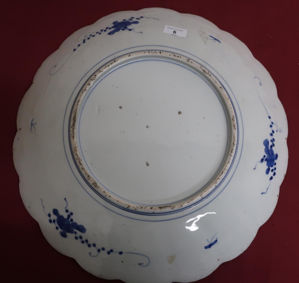 Japanese waved edge circular blue and white charger, all over decorated with chrysanthemums, - Image 2 of 2