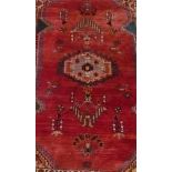 20th Century Caucasian pattern rug, red ground with stylized central medallion and geometric and