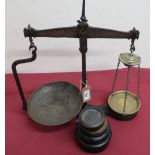 Late 19th C wrought iron and brass Grocery balance scale with twisted central column on platform