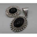 Silver and Whitby Jet oval pendant and a similar oval brooch, both stamped 925 (2)