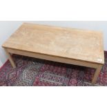 Blond Ercol rectangular low coffee table on turned supports, W107cm D54cm H38cm