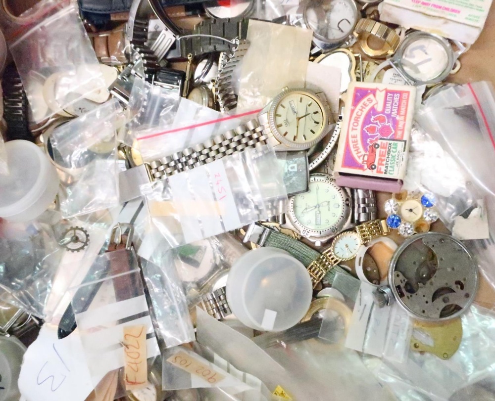 Large collection of various watch parts including bracelets, bezels, dials, pocket watch cases, etc