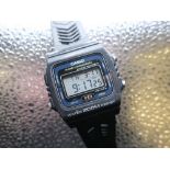 Casio LCD DW-240 200m alarm chronograph, synthetic case on rubber strap, stainless steel back