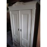 Craftsman made painted pine wardrobe with arched cornice, two panel doors above single drawer on