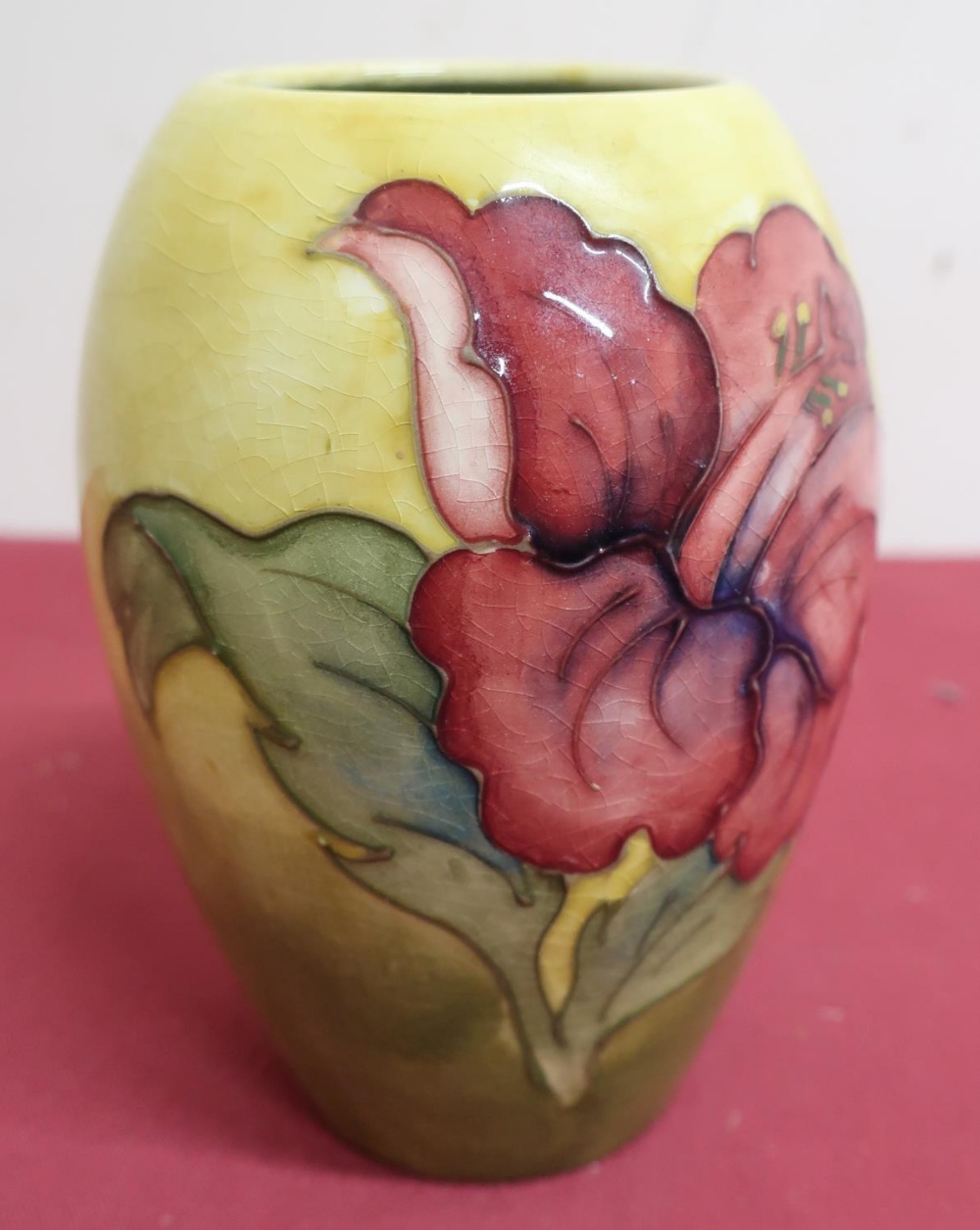 Moorcroft pottery vase, ovoid body tube line decorated with an anemone on a yellow ground, H13cm,