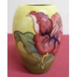 Moorcroft pottery vase, ovoid body tube line decorated with an anemone on a yellow ground, H13cm,