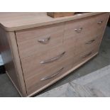 Modern beech side cabinet of seven drawers with chromed handles, W129cm H73cm D47cm