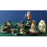 Border Fine Arts style pottery groups of animals including: a barn owl, dogs, blue tits and
