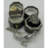 Marcasite ring size O, an Indian expandable ring with carved bone bird panel size Q, both stamped