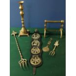 Pair of 19th C brass candlesticks with knopped stems on square bases, horse brasses, pair of fire